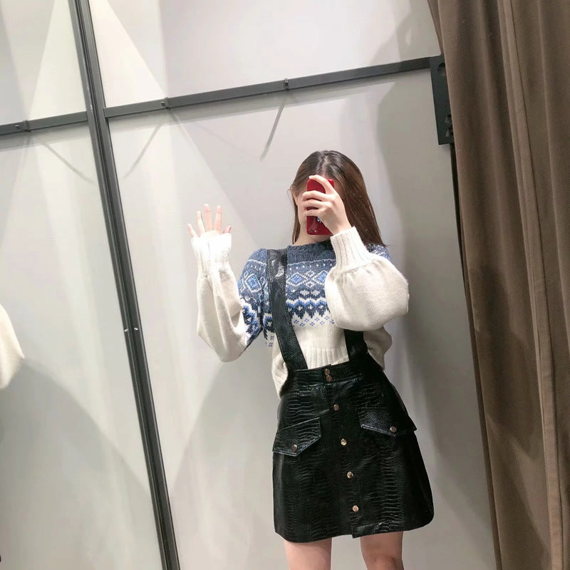 Faux leather mini skirt with strap