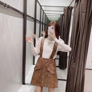 Faux leather mini skirt with strap