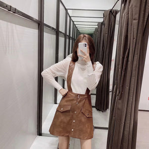 Faux leather mini skirt with strap